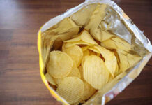Open bag of ridged potato chips