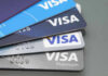 Stacked Visa credit cards in various colors