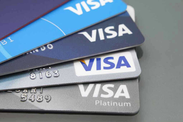 Stacked Visa credit cards in various colors